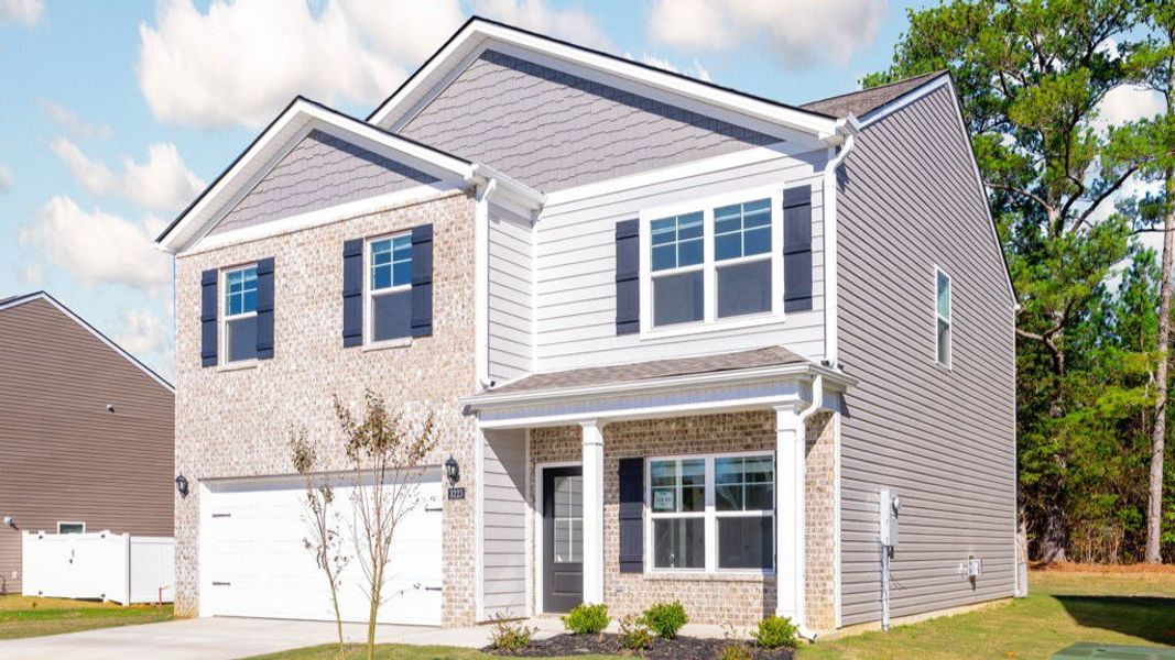 Front exterior of a new home in Hillcrest Landing, McDonald, TN, highlighting curb appeal (Image 14).
