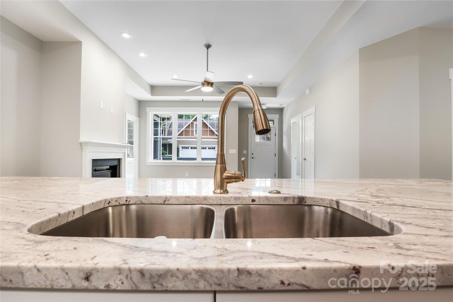 Open concept kitchen looking into the living room