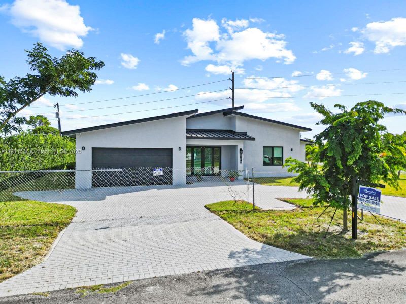 Front exterior of a new home in , Goulds, FL, highlighting curb appeal (Image 22). Front exterior of a new home in , Goulds, FL, highlighting curb appeal (Image 22).