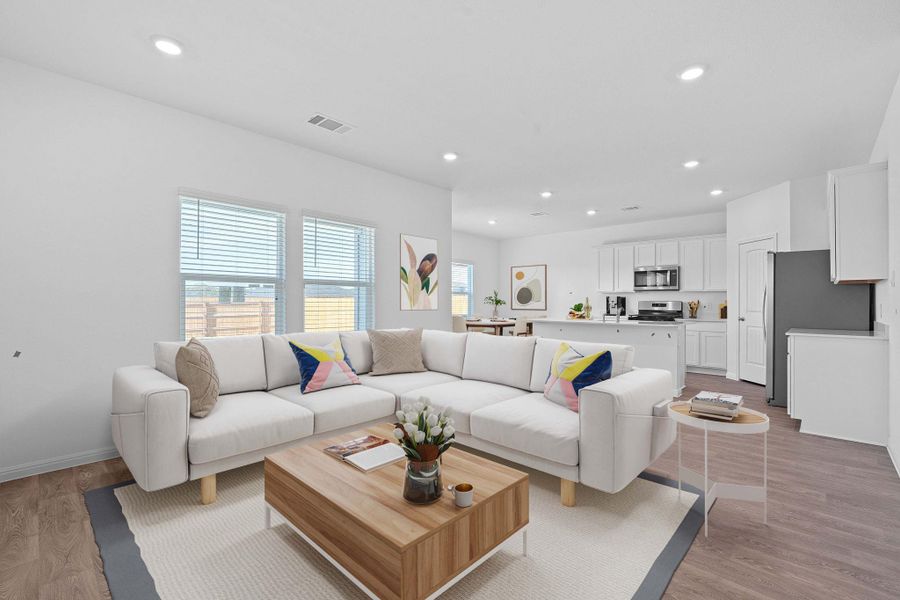 Living area featuring recessed lighting and light wood finished floors Living area featuring recessed lighting and light wood finished floors