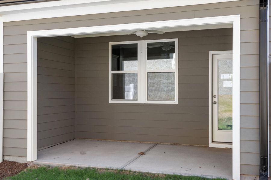 Exterior details and patio area of a home in Ovation at Sweetbrier, Durham (Image 3).