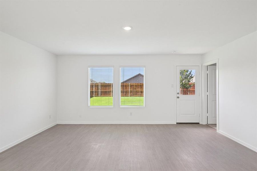 Unfurnished room with wood finished floors and recessed lighting Unfurnished room with wood finished floors and recessed lighting