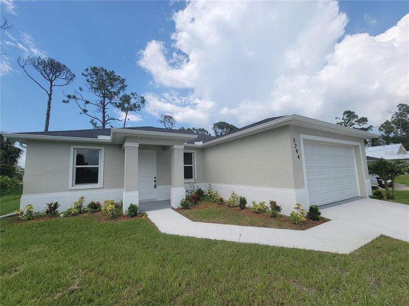 Front exterior of a new home in , North Port, FL, highlighting curb appeal (Image 20).