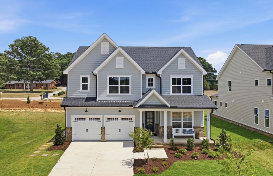 Representative exterior photo of a completed home built from the Stonebrook by Pulte Homes in The Preserve at Marks Creek, Knightdale, NC (Image 24). Representative exterior photo of a completed home built from the Stonebrook by Pulte Homes in The Preserve at Marks Creek, Knightdale, NC (Image 24).