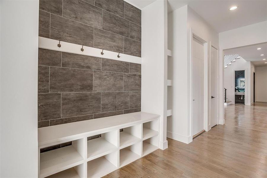 Mudroom featuring baseboards, wood finished floors, and recessed lighting