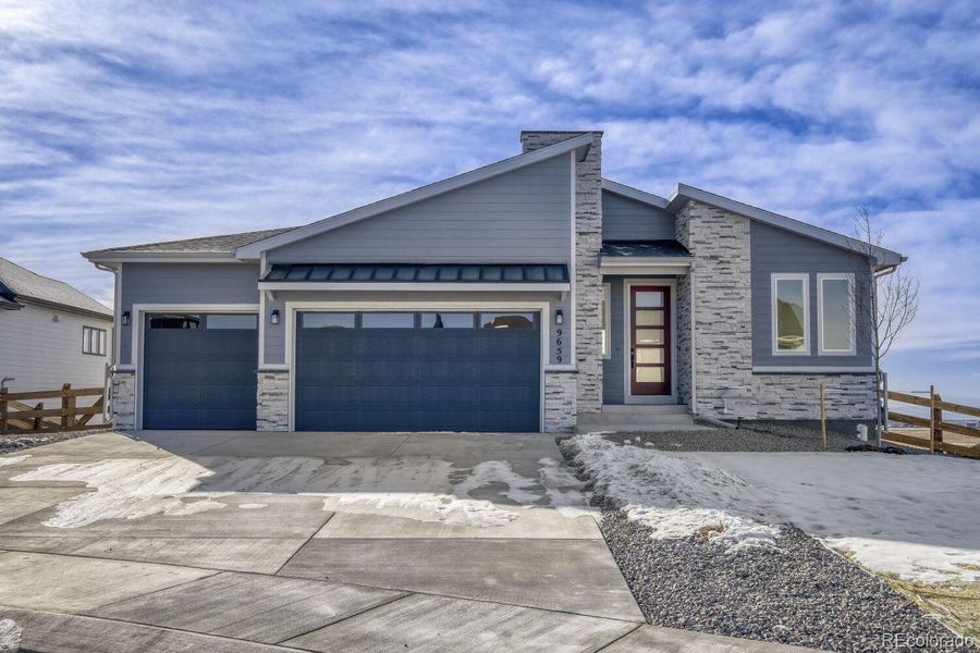 Front exterior of a new home in Timber Ridge, Colorado Springs, CO, highlighting curb appeal (Image 2).