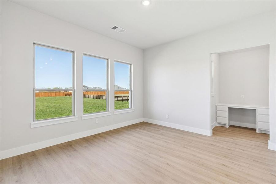 Unfurnished bedroom with light wood finished floors and recessed lighting