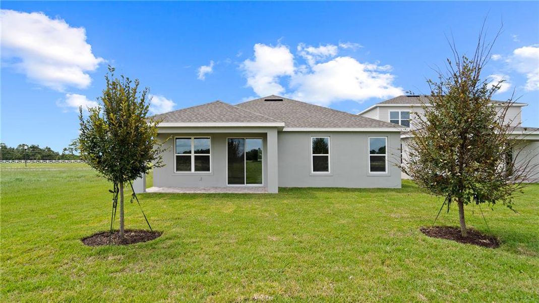 Front exterior of a new home in Trailside, Mount Dora, FL, highlighting curb appeal (Image 22).