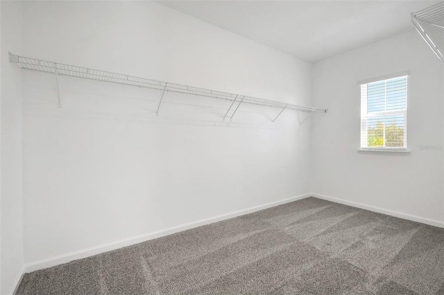 Spacious, unfurnished interior of a new home in Serenade at Ovation, Winter Garden (Image 22).