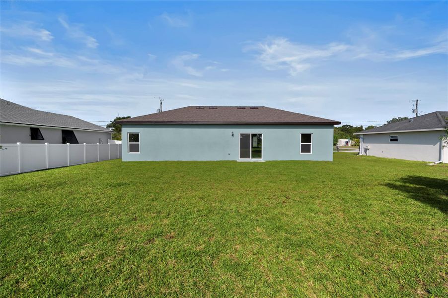 Front exterior of a new home in Port St Lucie, Port St. Lucie, FL, highlighting curb appeal (Image 12).