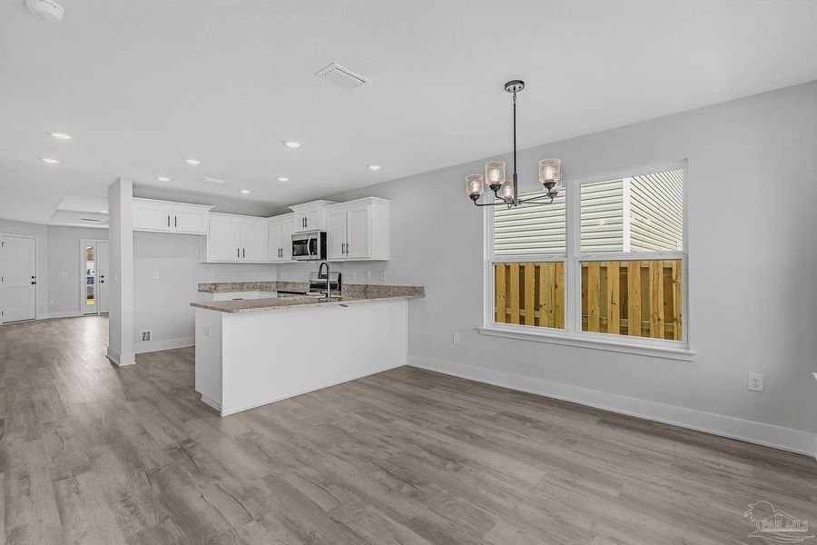Furnished interior view inside a new home in Allison Acres, Cantonment (Image 10).