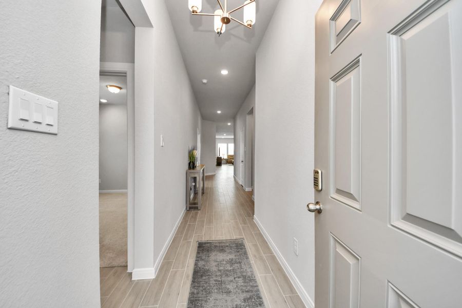 Beautiful entrance view of this one-story home with 4 Bedrooms and 3 full bathrooms!