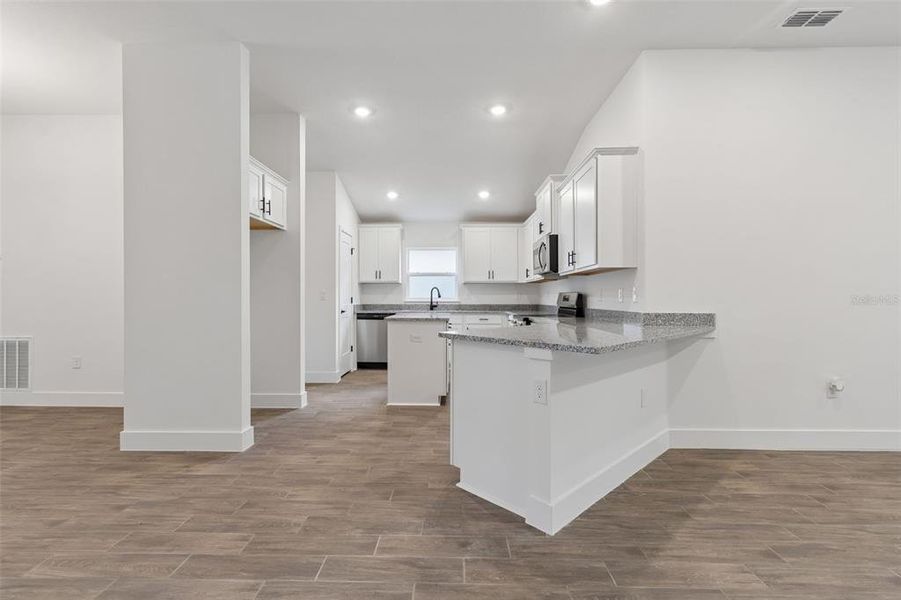 Furnished interior view inside a new home in Abbey Glen, Dade City (Image 12).