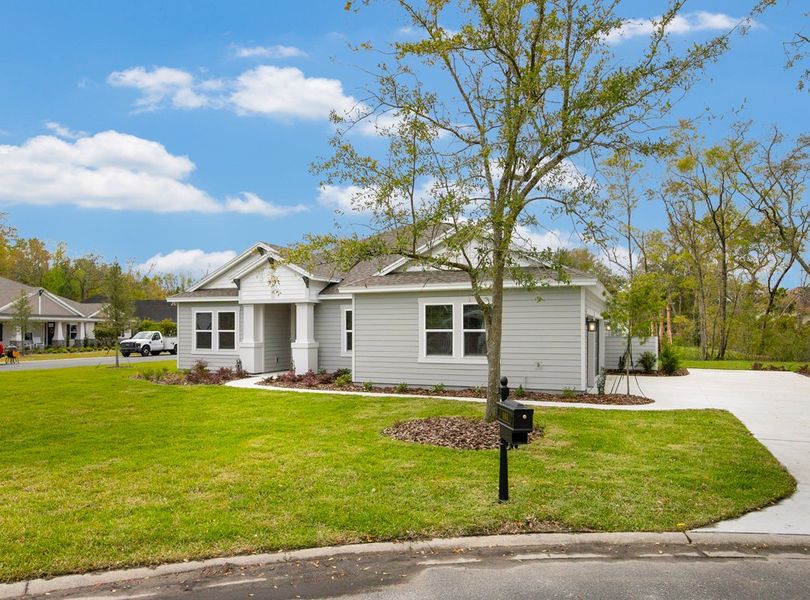 Front exterior of a new home in Osprey Cove, St. Marys, GA, highlighting curb appeal (Image 21). Front exterior of a new home in Osprey Cove, St. Marys, GA, highlighting curb appeal (Image 21).