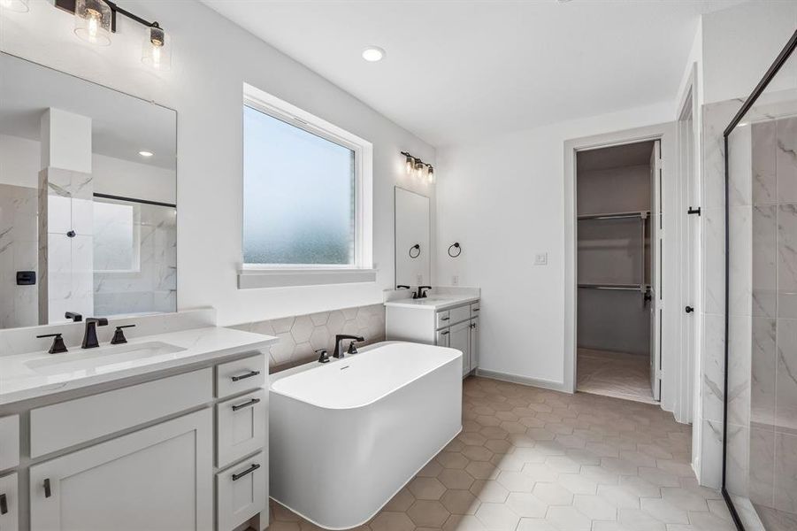 Packed with style and thoughtful design elements, your new owner's bath is the perfect place to start or end your day!
