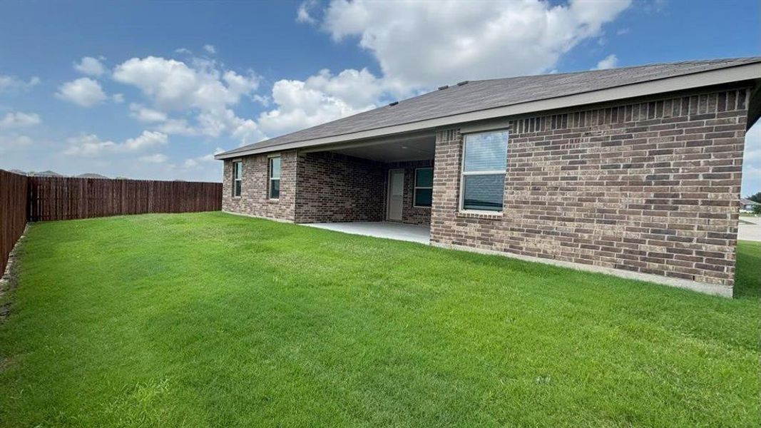 Front exterior of a new home in Legado, Cleburne, TX, highlighting curb appeal (Image 13).