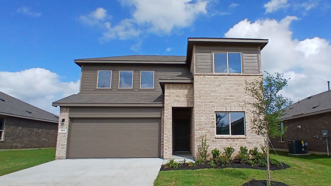 Front exterior of a new home in The Canyons, Keene, TX, highlighting curb appeal (Image 1). Front exterior of a new home in The Canyons, Keene, TX, highlighting curb appeal (Image 1).