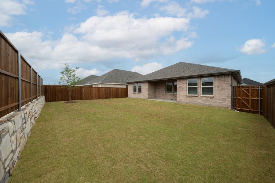 Exterior details and patio area of a home in Whitewing Trails, Princeton (Image 2).