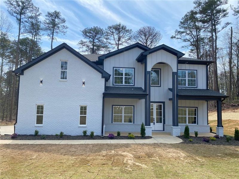 Front exterior of a new home in , Snellville, GA, highlighting curb appeal (Image 26).