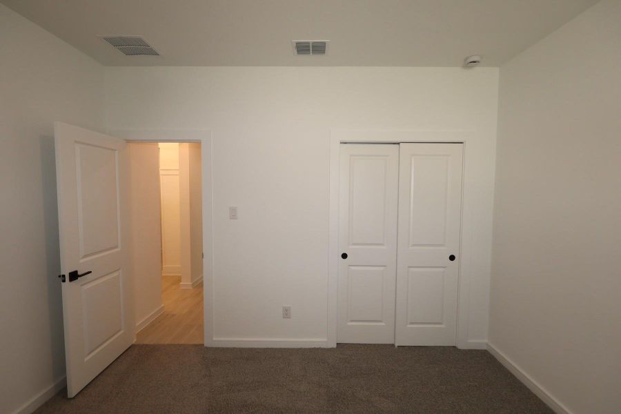 Spacious, unfurnished interior of a new home in Tarkington Timbers, Cleveland (Image 20).