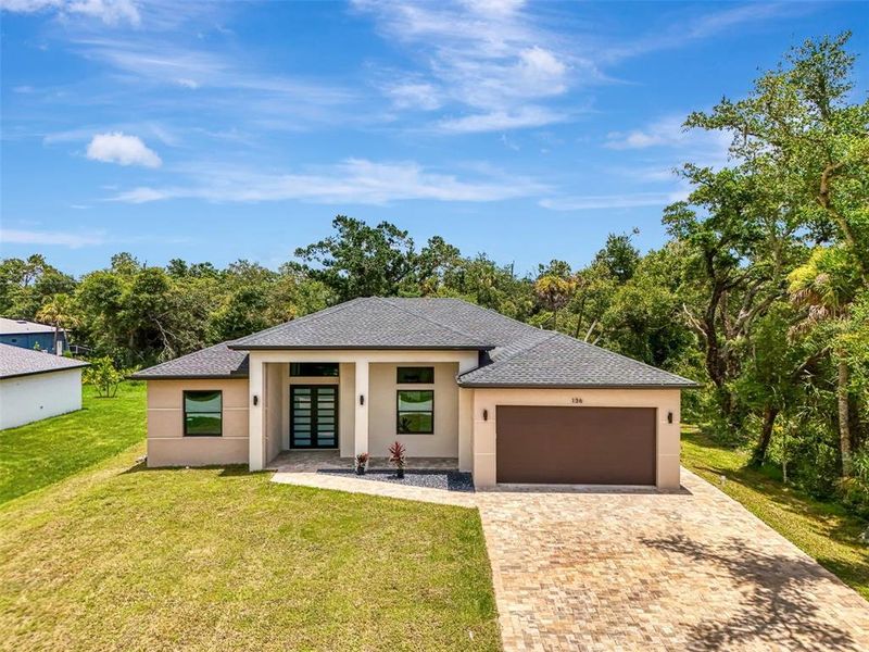 Front exterior of a new home in , Port Charlotte, FL, highlighting curb appeal (Image 37).