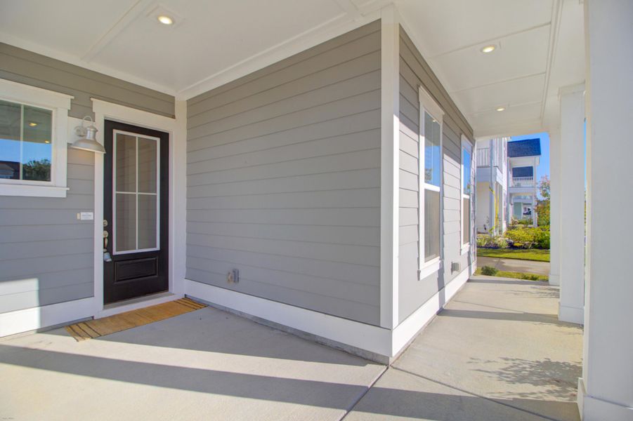 Exterior details and patio area of a home in Carnes Crossroads: Row Collection, Summerville (Image 1). Exterior details and patio area of a home in Carnes Crossroads: Row Collection, Summerville (Image 1).