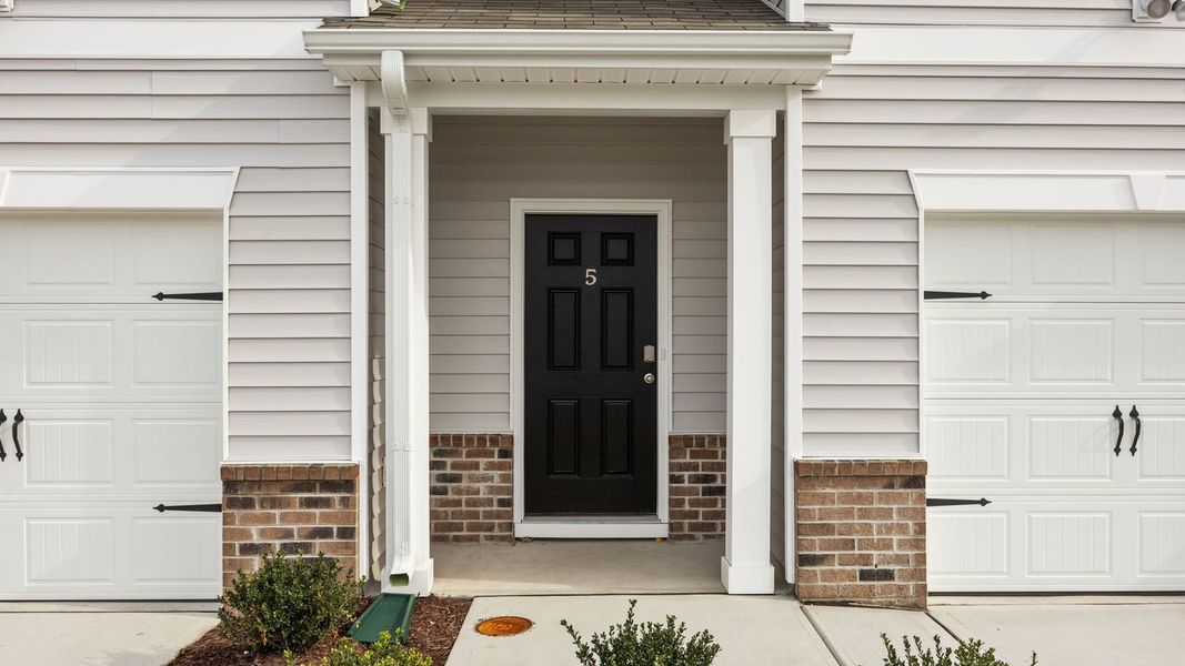 Exterior details and patio area of a home in The Townes at Ridgewood Farms, Winterville (Image 3). Exterior details and patio area of a home in The Townes at Ridgewood Farms, Winterville (Image 3).