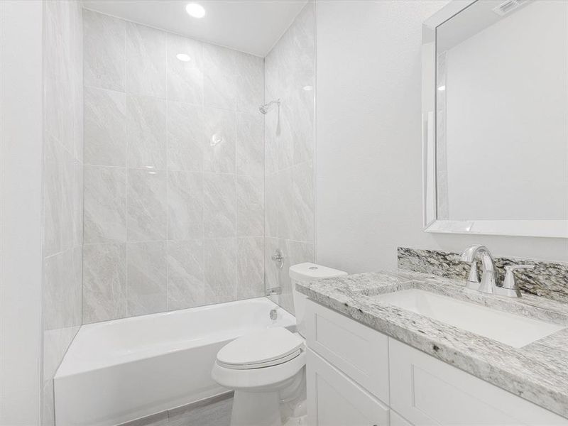 Full bathroom with shower / bathtub combination and vanity