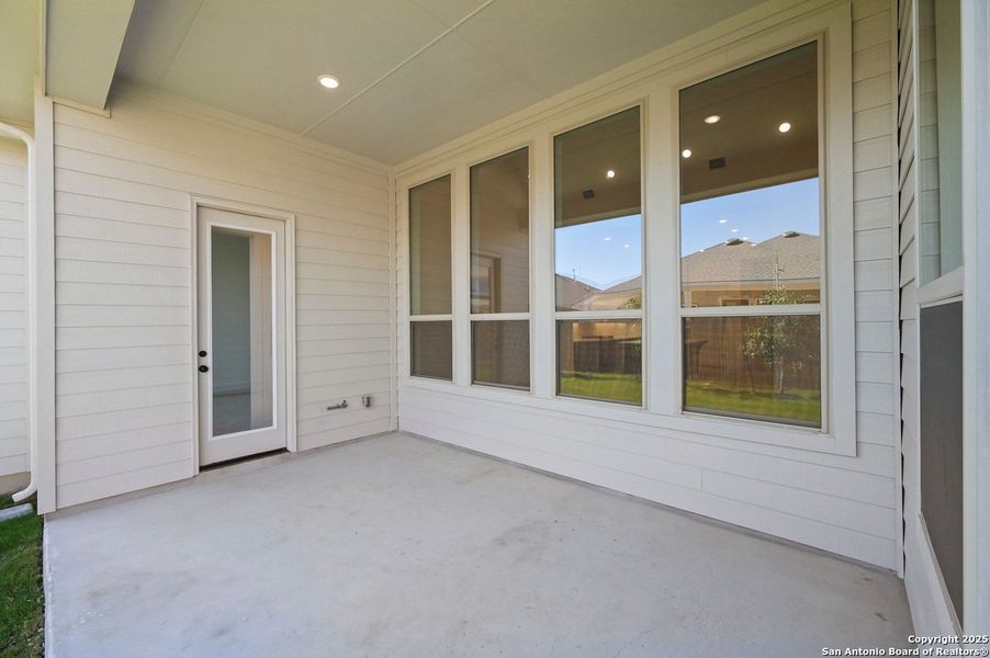 Exterior details and patio area of a home in Davis Ranch: 60ft. lots, San Antonio (Image 17).