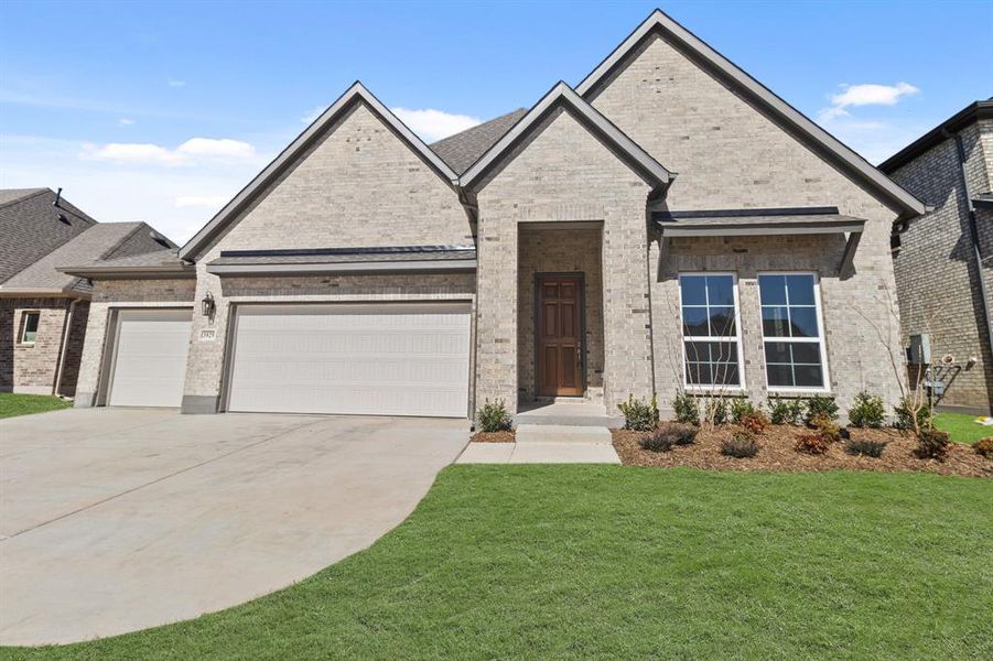 Front exterior of a new home in Lyons Crest Estates, Garland, TX, highlighting curb appeal (Image 1). Front exterior of a new home in Lyons Crest Estates, Garland, TX, highlighting curb appeal (Image 1).
