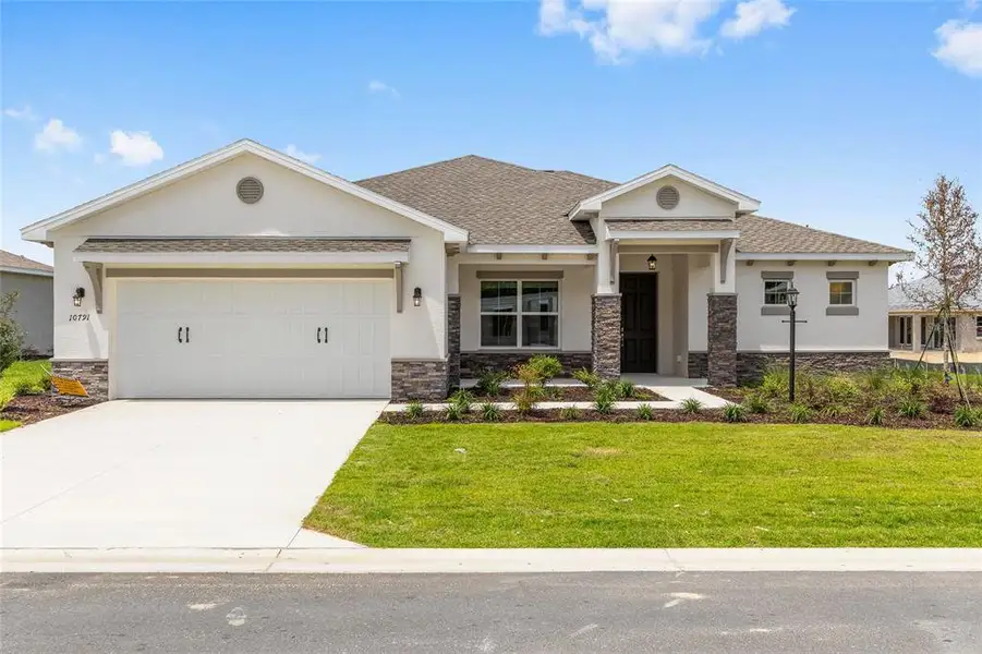 Front exterior of a new home in , Ocala, FL, highlighting curb appeal (Image 1). Front exterior of a new home in , Ocala, FL, highlighting curb appeal (Image 1).