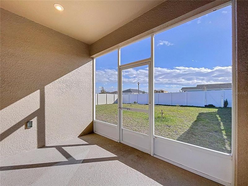 Exterior details and patio area of a home in Covered Bridge at Liberty Bluff, Haines City (Image 34).