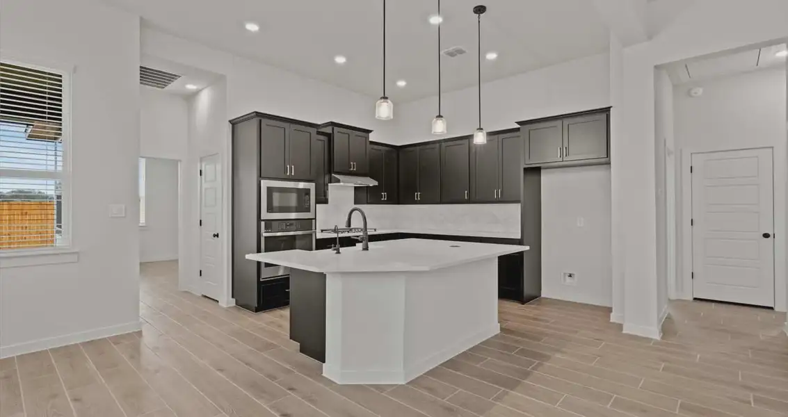 Representative furnished interior of a home built from the Rhyan by Chesmar Homes in Stream Waters, Buda (Image 3).