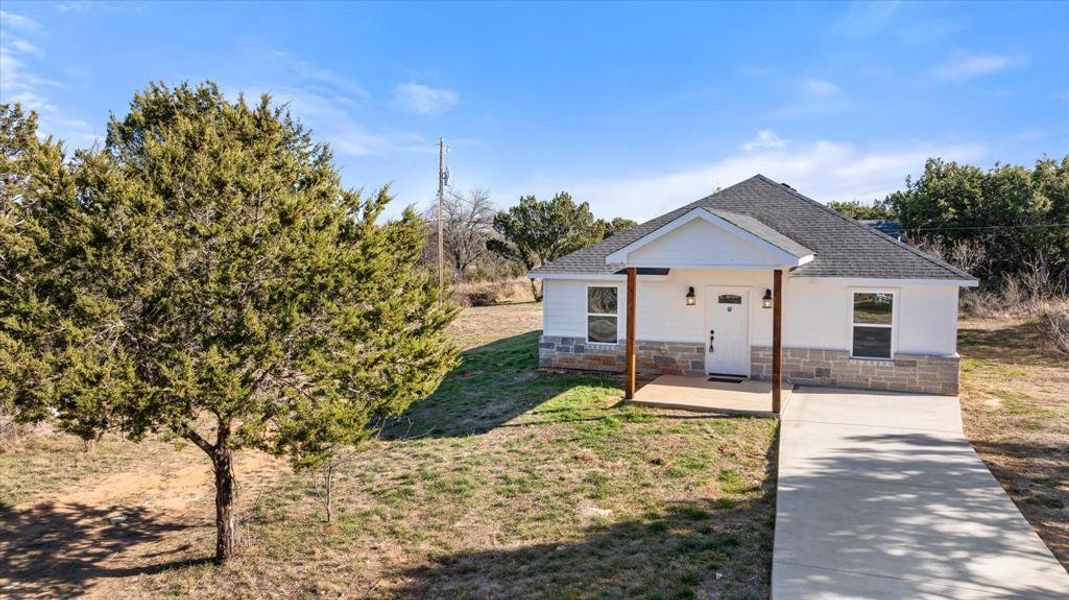 View of front of property with a front lawn