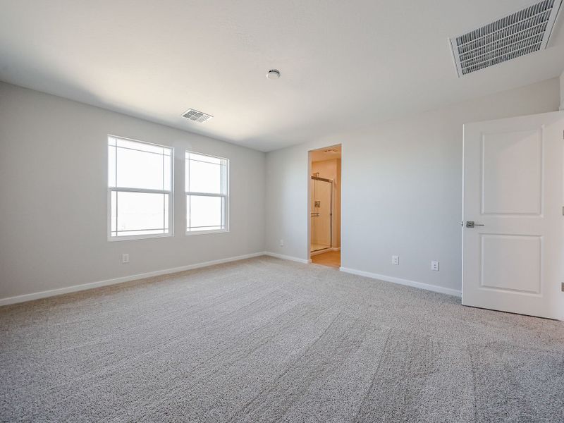 A room with a carpet and a door. A room with a carpet and a door.