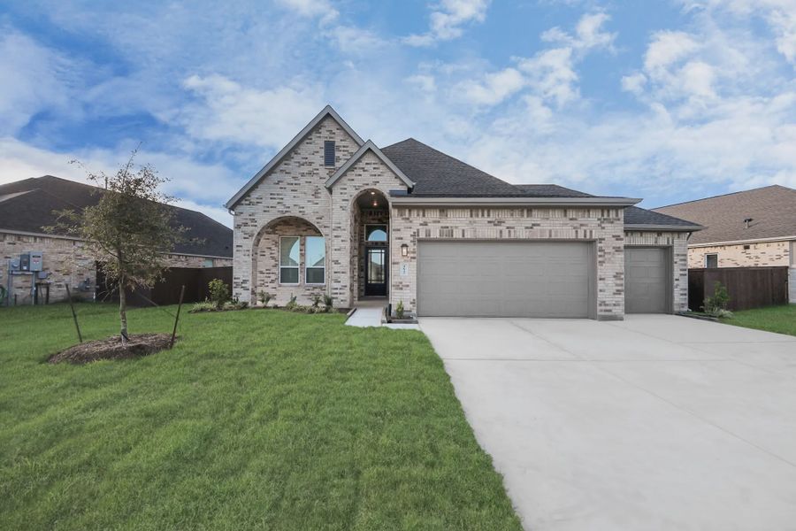 Representative exterior photo of a completed home built from the Bonneville by Chesmar Homes in Meridiana 50's and 60's, Manvel, TX (Image 24).