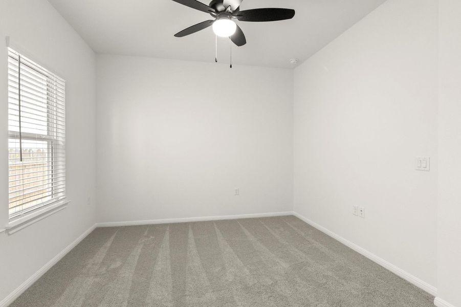 Unfurnished room with carpet floors and ceiling fan