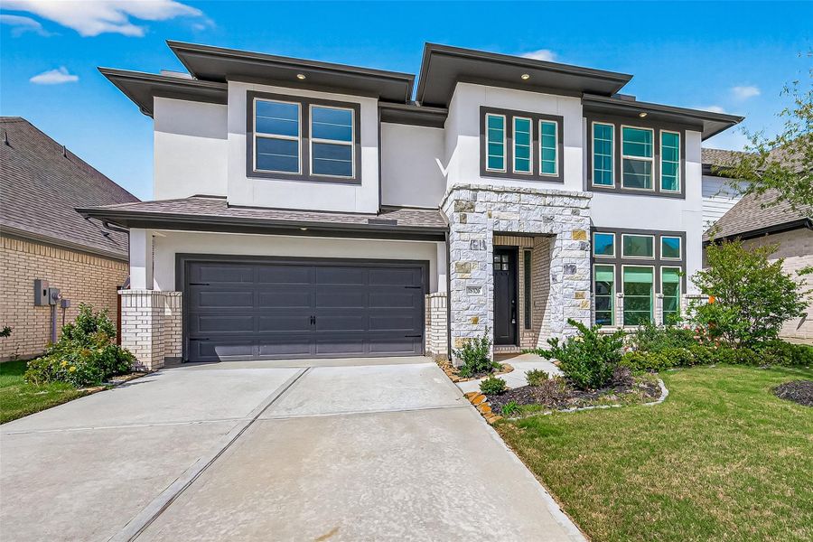 Front exterior of a new home in , Cypress, TX, highlighting curb appeal (Image 28). Front exterior of a new home in , Cypress, TX, highlighting curb appeal (Image 28).
