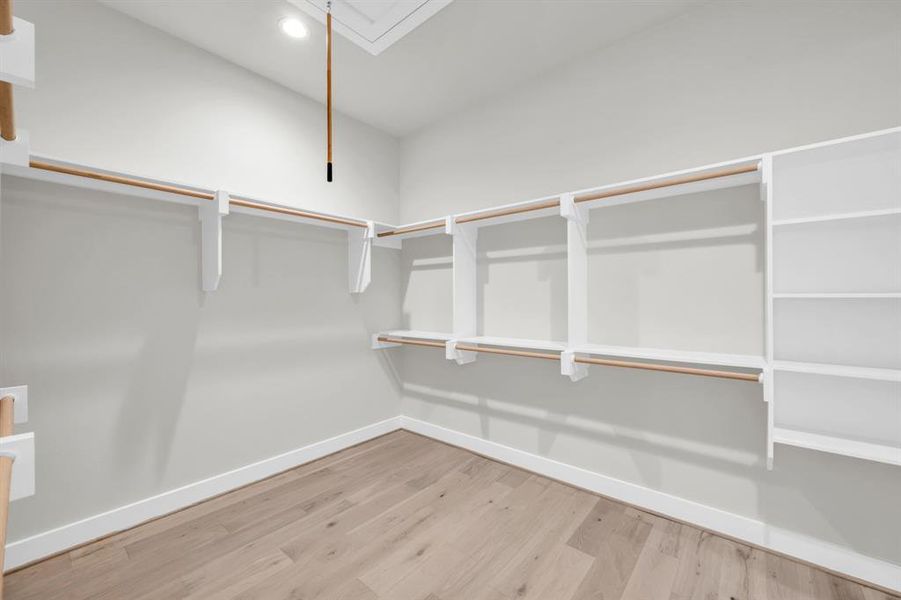 The larger of two primary closets. This one connects to the laundry room