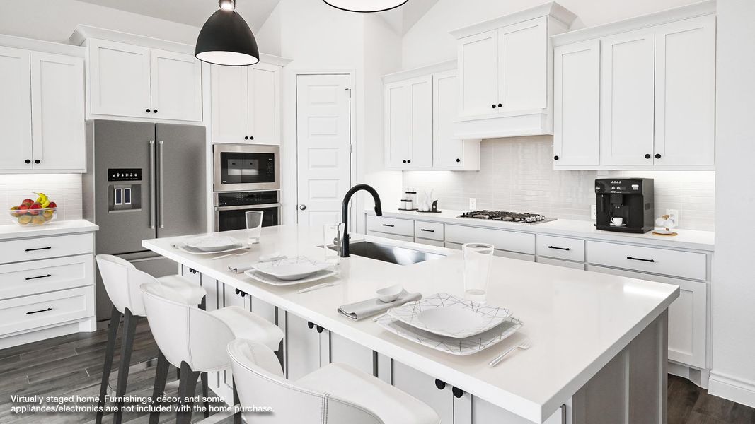 Kitchen with a sink, stainless steel appliances, white cabinets, dark wood finished floors, and decorative backsplash