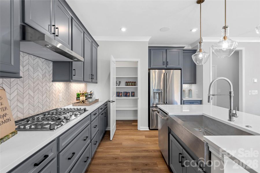 Stainless GE appliances and thoughtfully placed storage. Stainless GE appliances and thoughtfully placed storage.