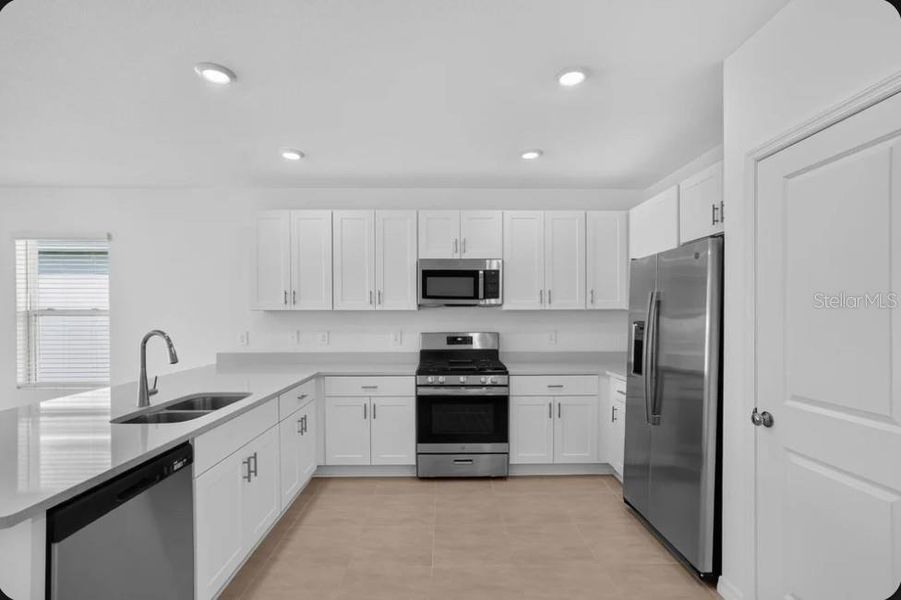 Furnished interior view inside a new home in Coasterra Community Group Page, Palmetto (Image 6).