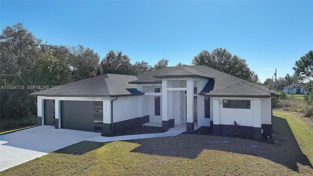 Front exterior of a new home in , Lehigh Acres, FL, highlighting curb appeal (Image 30).