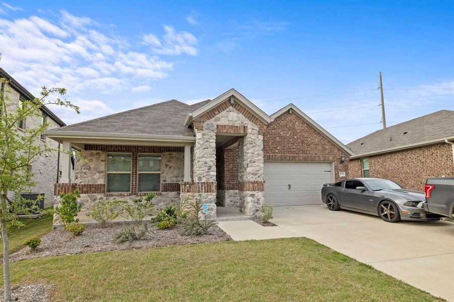 Front exterior of a new home in Stonehaven, Seagoville, TX, highlighting curb appeal (Image 24).