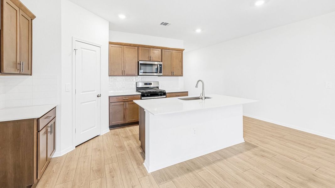 Furnished interior view inside a new home in Bar W Ranch, Leander (Image 10).