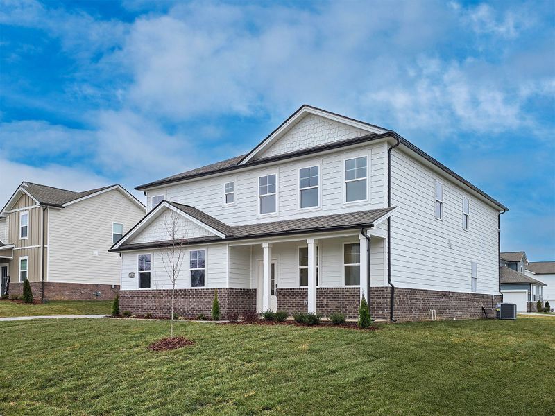 A large house with a brick wall.