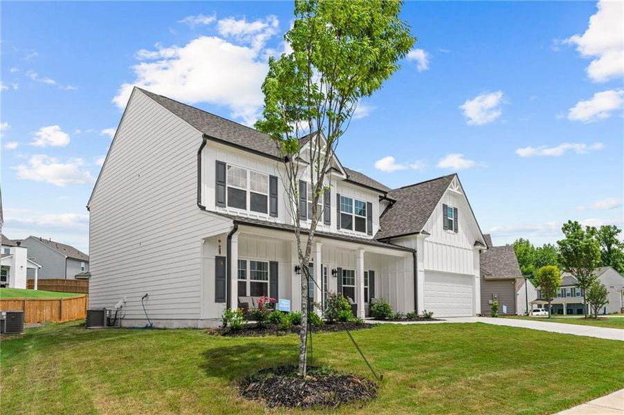 Front exterior of a new home in , Canton, GA, highlighting curb appeal (Image 1). Front exterior of a new home in , Canton, GA, highlighting curb appeal (Image 1).