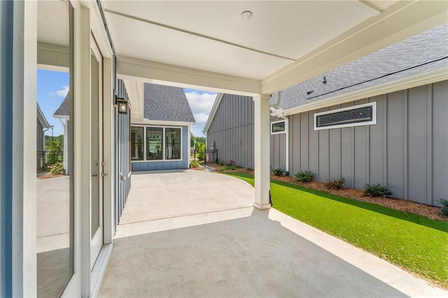 Exterior details and patio area of a home in The Courtyards at Redbud Lane, Canton (Image 13).