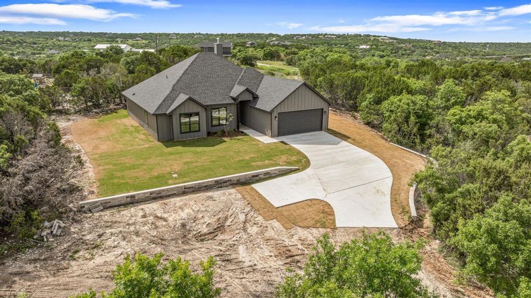 Front exterior of a new home in , Bluff Dale, TX, highlighting curb appeal (Image 24).