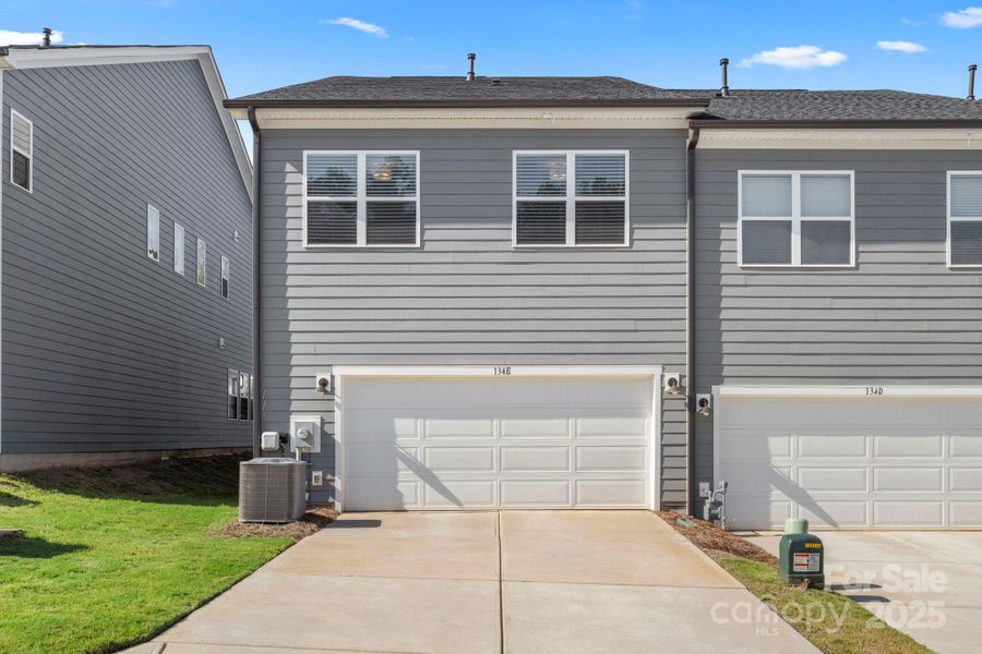 Front exterior of a new home in , Mooresville, NC, highlighting curb appeal (Image 2).